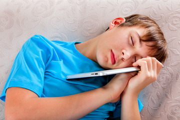 Teenager sleep with a Tablet