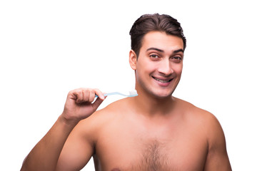 Fototapeta premium Handsome man brushing his teeth isolated on white