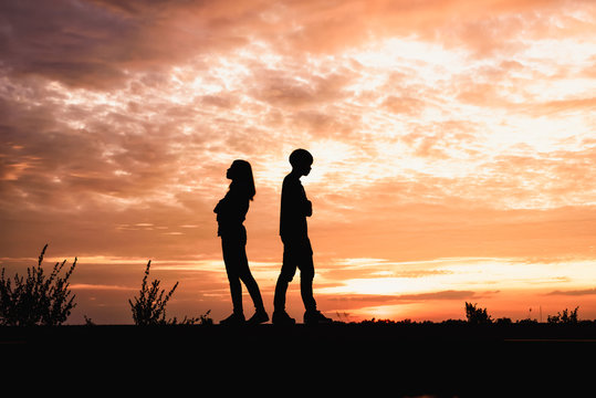 Silhouette of  couple in love ,man and women are quarrel in natu