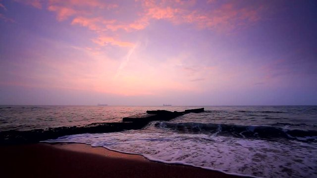 Beautiful sunrise over the sea with dramatic clouds on the sky