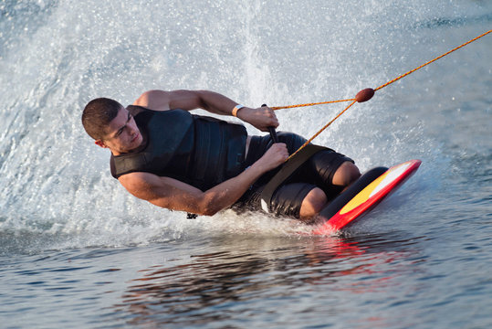Kneeboarder . Kneeboarding close-up action