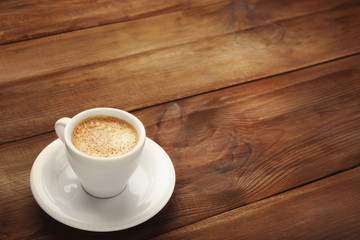 Fototapeta premium Cup of coffee on wooden background