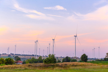 Obraz premium Wind turbines at sunset