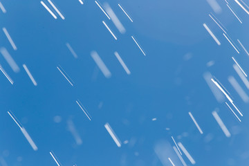 rain drops on a background of blue sky