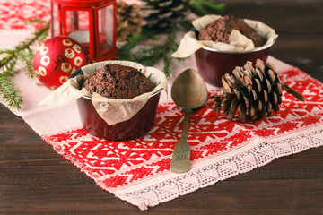 Two muffins, chocolate muffin and cinnamon muffins - sweet food