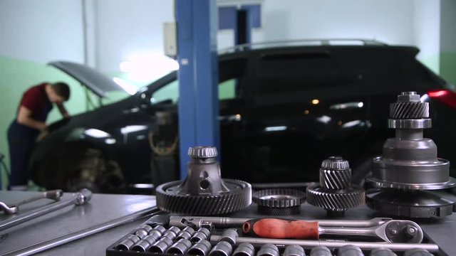 tools and auto parts in the background of the service