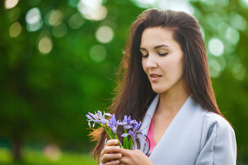 Girl in grey coat with flowers