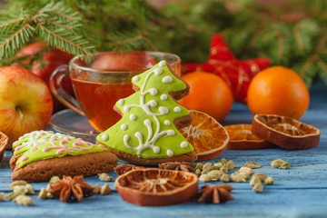 Fototapeta na wymiar Christmas cup of tea and spices on wooden table