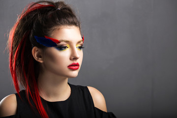 Beautiful girl.Professional makeup, red lips, photographed in St