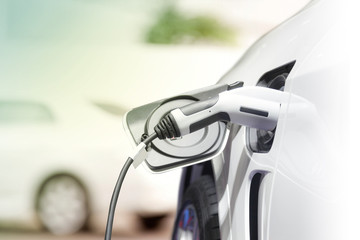 Obraz premium Ładowanie samochodu elektrycznego, Przyszłość transportu