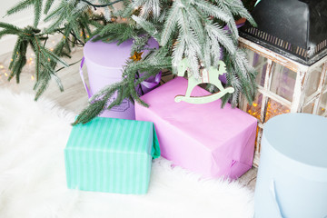 Blue and pink gift boxes with pink bow on white background under