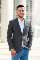 Portrait of an handsome businessman in an urban setting