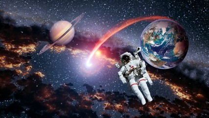 Astronaut planet Earth Saturn spaceman launch outer space galaxy universe. Elements of this image...