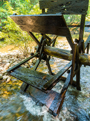Working watermill wheel in stream