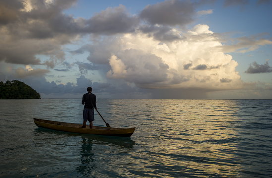 A man in a dug out canoe, Solomon Islands 