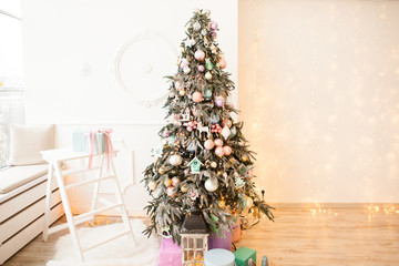 Christmas tree decorated with glass and wooden vintage toys and