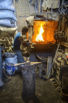 Metal smith, Medebar market, Asmara, capital of Eritrea
