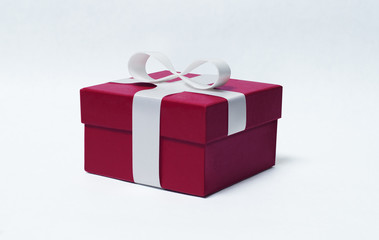 Red gift box with white ribbon