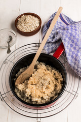 fresh warm porridge in an enamel pot
