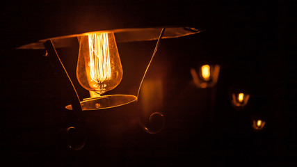 Decorative antique edison style light bulbs chandelier background