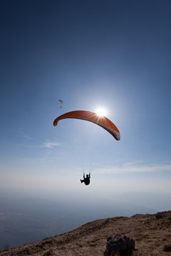 Paragliders flying over Mount Cuarnan, Udine, Friuli