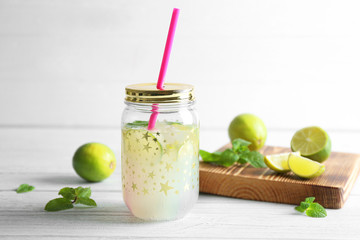 Lime lemonade in mason jar on wooden table