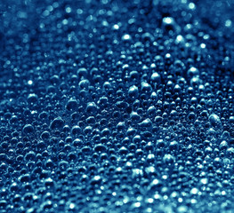 Close up, Water drop on blue background.