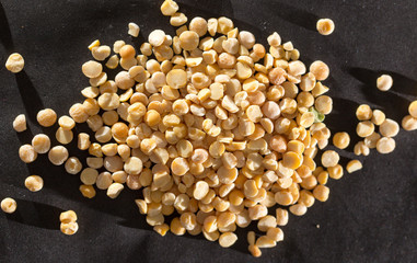 yellow peas on a black background