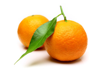 Mandarin, tangerine citrus fruit, with green leaf, isolated on white background.