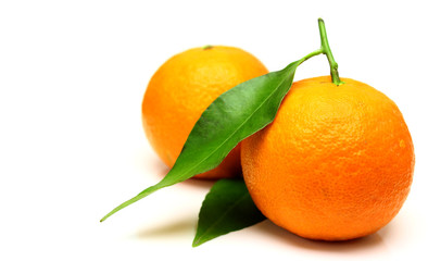 Mandarin, tangerine citrus fruit, with green leaf, isolated on white background.