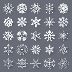 White snowflake shapes set isolated on grey background.