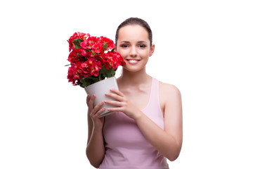 Woman with pot of red flowers isolated on white