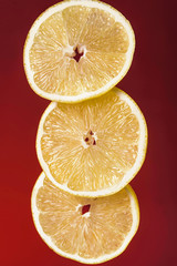 Naklejka na ściany i meble Three fresh juicy lemon slices