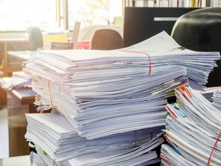 Close up of business documents stack on desk , report papers stack