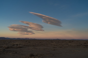 Desert background with lenticular clouds in California.