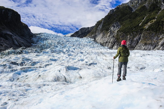Woman standing on the ice of Fox Glacier, Westland Tai Poutini National Park, South Island, New Zealand