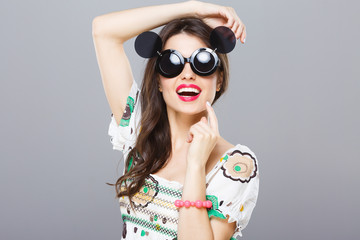 Beautiful model in sunglasses with side glasses