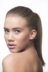 Natural make up girl face blond hair with ponytail