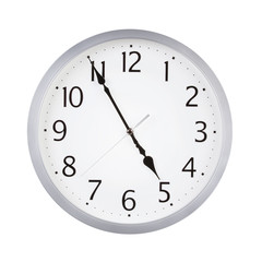 Office round clock shows almost five hours