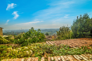 old roofs under a blue sky