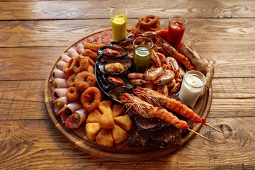 Seafood platter on wooden table background