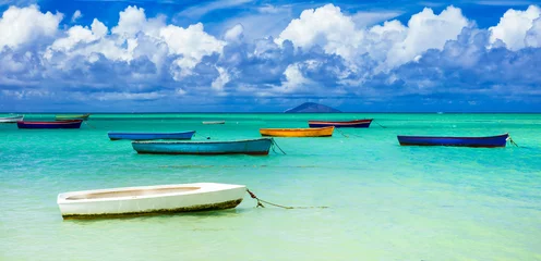 Printed kitchen splashbacks Coast old rustic fishermen' boats in turquoise sea. Mauritius island scenery