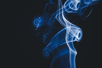 Obraz premium Blue smoke on black background.