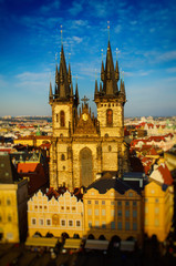 Obraz premium Old Town Square with Church of Our Lady before Tyn in Prague - panoramic sunny view from Town Hall with tilt-shift effect