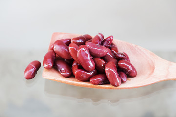 Red beans in a wooden ladle