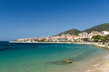 Fototapeta na wymiar The rocks and pebbles of the shoreline in Ajaccio in Corsica
