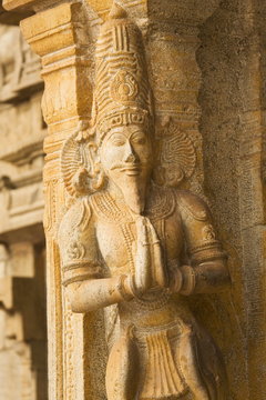 A Hindu sculpture gives the Namaste welcome at the Brihadeeswarar Temple (Big Temple) in Thanjavur (Tanjore), Tamil Nadu