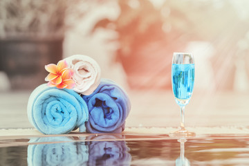 Beautiful blue cocktail beside on the swimming pool with towel