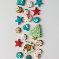 Fototapeta na wymiar Colorful pattern made of Christmas cookies and red berries. Flat