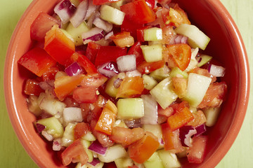 A bowl of Israeli tomato and cucumber salad 